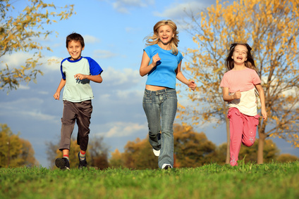 Happy Family Running Outdoor.