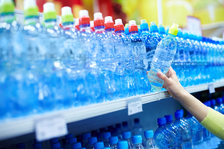Close Up,of,female,choosing,good,mineral,water,in,a,shop