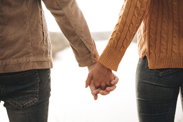 Back View Couple Holding Hands 2