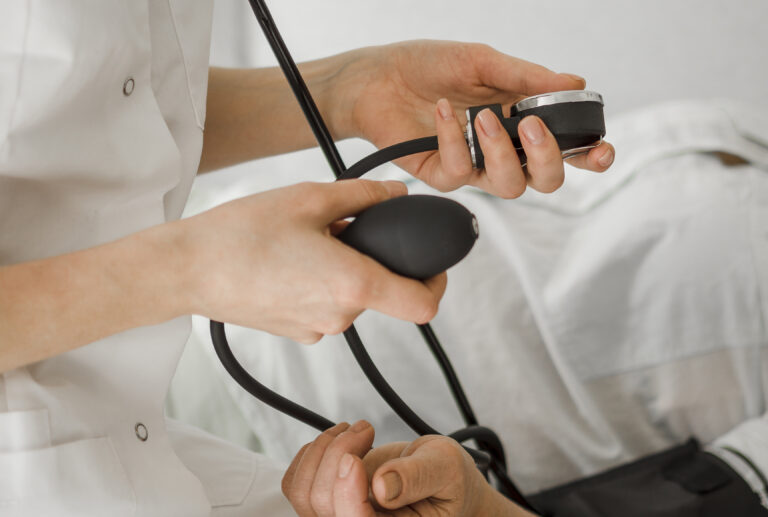 Doctor Checking Blood Pressure