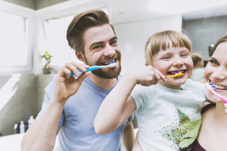 Daughter Parents Brushing Teeth